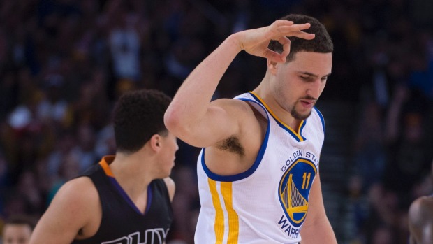 Warriors guard Klay Thompson celebrates a three-point basket during his side's 128-103 win over the Suns