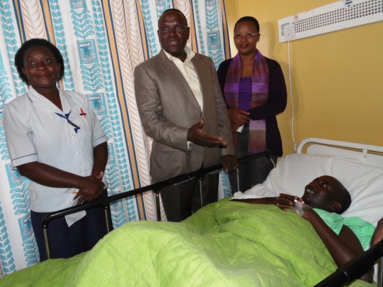 Senior nursing officer Erina Bwibo Health cabinet secretary Cleopa Mailu and KNH CEO Lily Koros when the CS visited Monday Mandera bus terror attack survivor Sabdul Farah in ICU on December 27