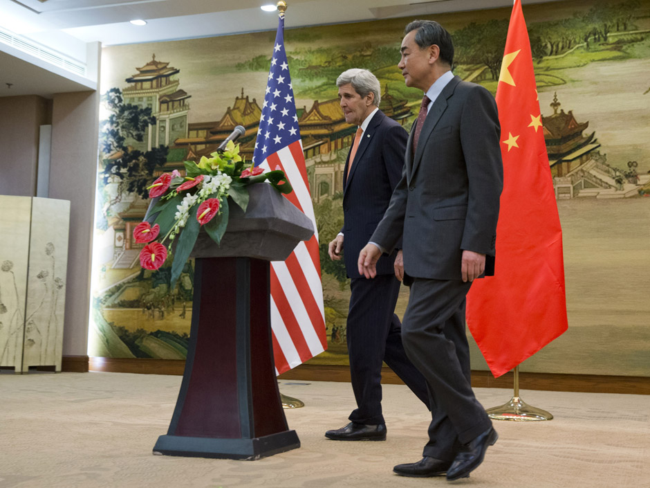 U.S. Secretary of State John Kerry left leaves a news conference with Chinese Foreign Minister Wang Yi at the Ministry of Foreign Affairs in Beijing Wednesday Jan. 27 2016