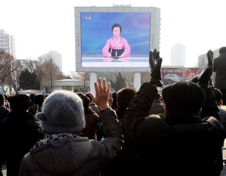 North Koreans watch a news broadcast on a video screen outside Pyongyang Railway Station in Pyongyang North Korea Wednesday Jan. 6 2016. North Korea said Wednesday it had conducted a hydrogen bomb test a defiant and surprising move that if confirmed