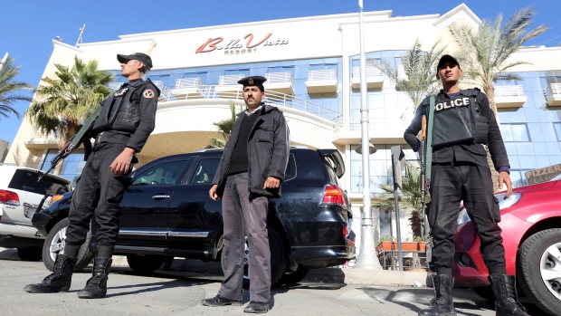 Security personnel guard the entrance to the Bella Vista hotel after two knife-wielding assailants wounded three foreign tourists