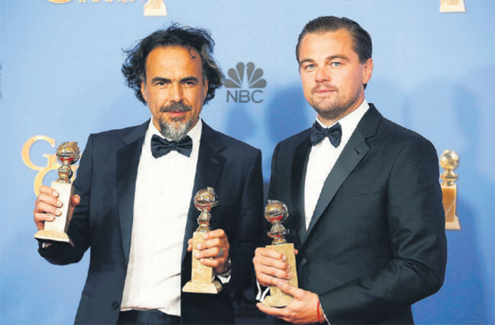 WINNERS. Director Alejandro Gonzalez Inarritu with his Golden Globe awards for best director and best motion