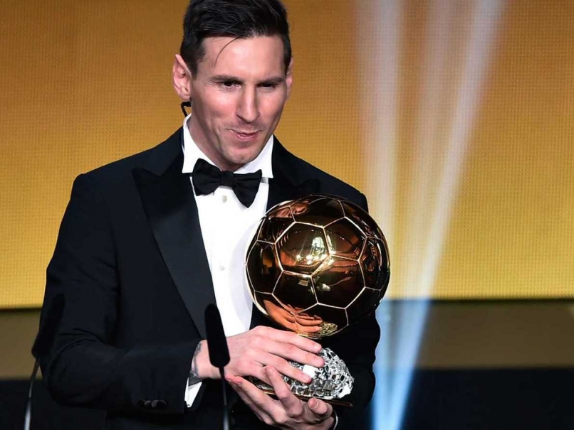 Lionel Messi poses with the Ballon D'Or trophy in Zurich