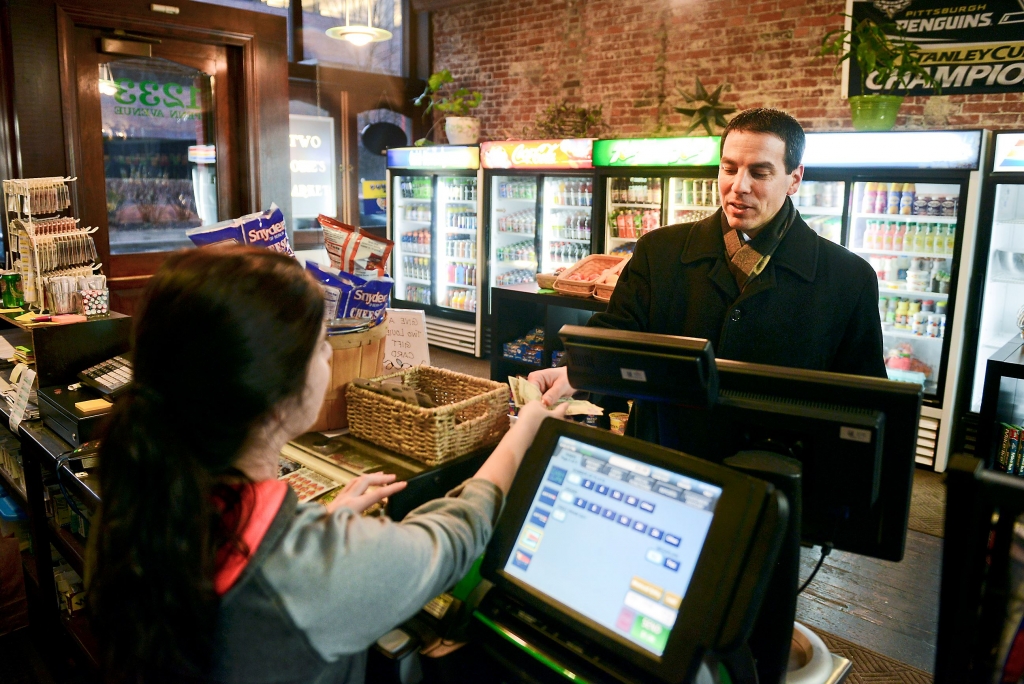 Danielle D'Amico sells a Powerball ticket to Rob Matthews Danielle D'Amico sells a Powerball ticket to Rob Matthews of Fox Chapel on Friday evening at Two Louie's Market