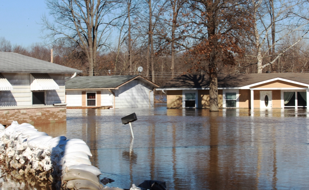 Several homes sit in flood water from the Meramec River behind failed sand bags as the river begins to recede in Arnold Missouri