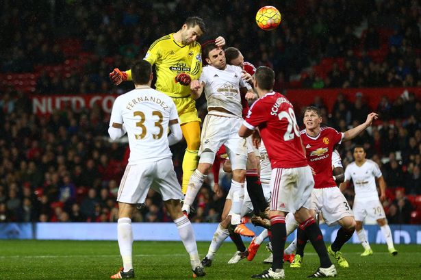 Lukasz Fabianski of Swansea City heads the ball at goal late