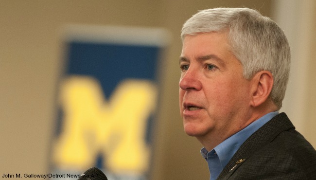 Gov. Rick Snyder speaks during a'Day of Service honoring Martin Luther King Jr. at the University of Michigan- Flint in Flint Mich. Monday Jan. 18 2016