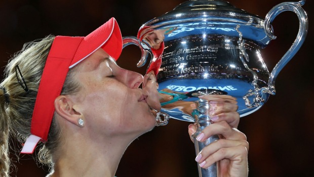 MICHAEL DODGE  GETTY IMAGES 
 
   Angelique Kerber of Germany kisses the Daphne Akhurst Trophy as the Australian Open women's singles champion