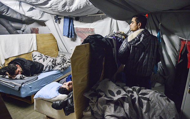 MIgrants rest at the refugee tent camp in Thisted Denmark earlier this month