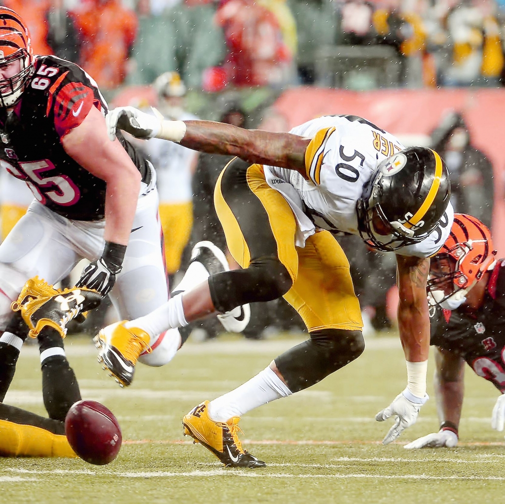 SteelersBengals0111d-4 Steelers&#39 DB Mike Mitchell and LB Ryan Shazier look to recover a fumble by Bengals&#39 Jeremy Hill after Shazier stripped him of the ball in the fourth quarter of the AFC Wild Card game Saturday at Paul Brown Stadium