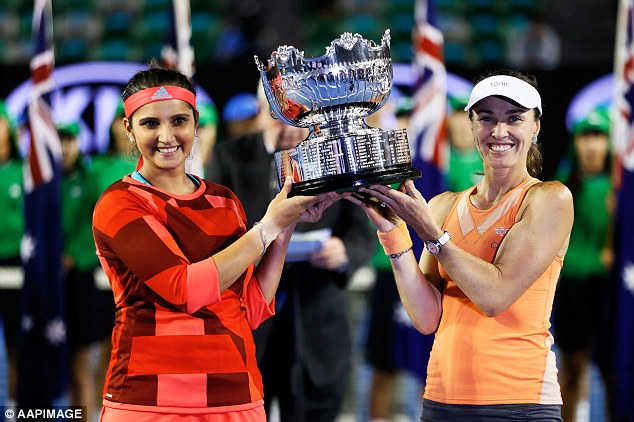 Martina Hingis and Sania Mirza celebrate after their win in the women's doubles at the Australian Open