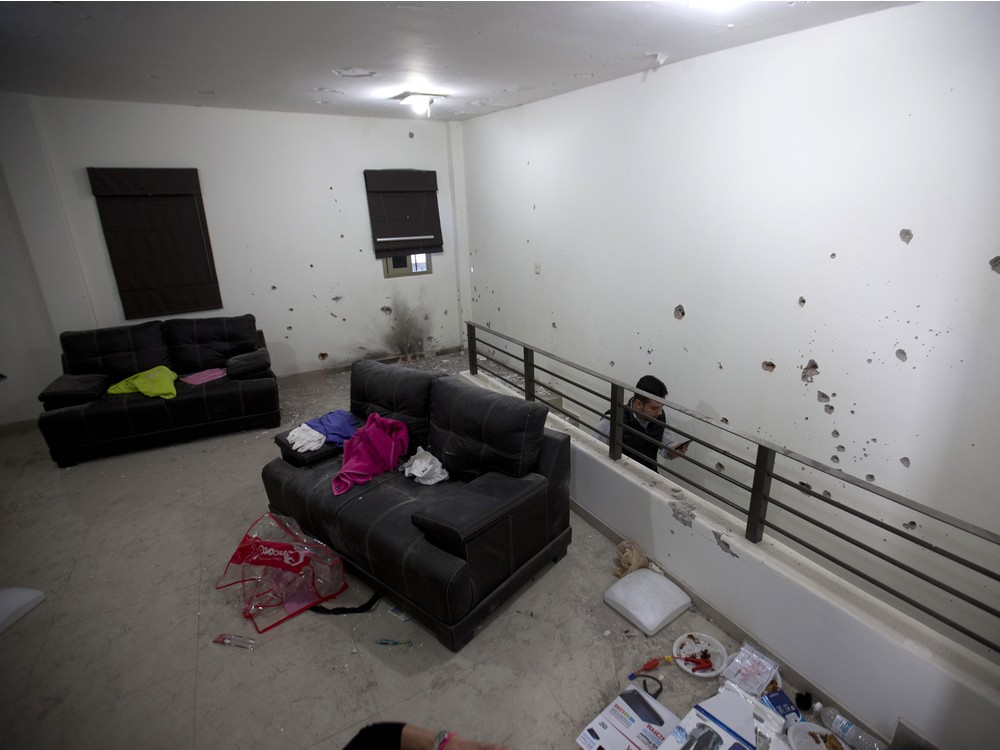 Bullet holes riddle the walls of the second floor of the home that marines raided in the search for Mexican drug lord Joaquin'El Chapo Guzman in Los Mochis Mexico Monday Jan. 11 2016. On Friday Guzman and his security chief traveled several blocks