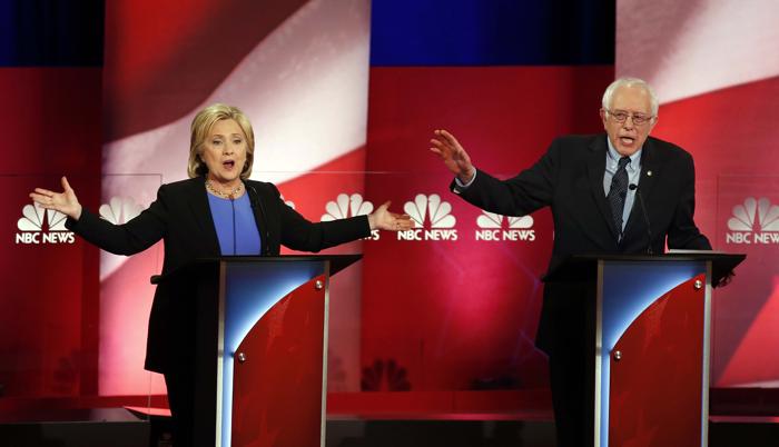 Democratic presidential candidates former Secretary of State Hillary Clinton left and Sen. Bernie Sanders I-Vt. talk over each other during the Democratic presidential primary debate at the Gaillard Center Sunday Jan. 17 2016 in Charleston S.C