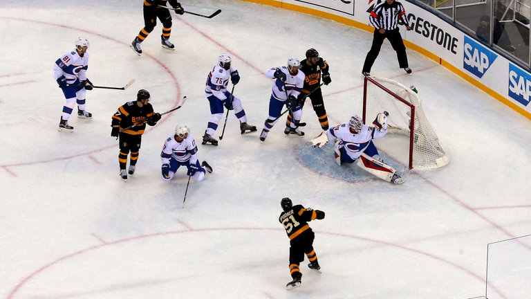 Mike Condon makes a glove save on a shot from Boston's Ryan Spooner in the second period