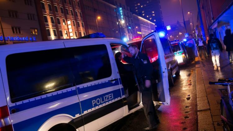 Police stand guard outside the Munich train station