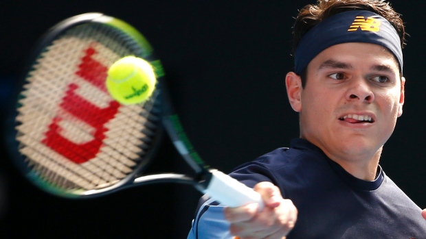 Milos Raonic of Canada makes a forehand return to Stan Wawrinka of Switzerland during their fourth round match at the Australian Open tennis championships in Melbourne Australia on Monday Jan. 25 2016