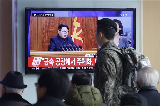 A South Korean army soldier passes by a TV news program showing North Korean leader Kim Jong Un's New Year speech at the Seoul Railway Station in Seoul South Korea on Friday. Kim said in an annual New Year speech that he's ready for war if provoked