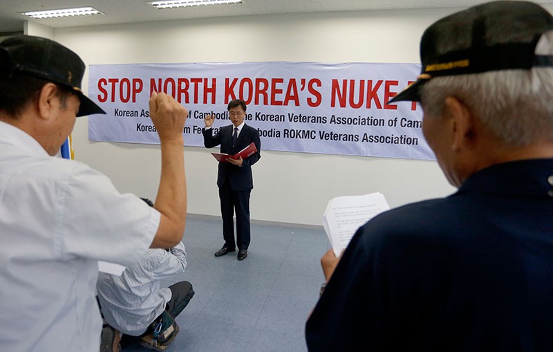 Yang Sungmo chairman of the Korean Association of Cambodia reads out a statement condemning North Korea’s nuclear testing during a protest in Phnom Penh Tower on Friday