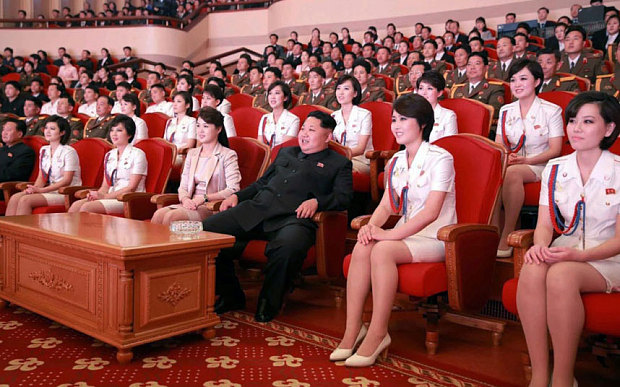 North Korean leader Kim Jong-un and his wife Ri Sol-ju, along with members of an all-female music band known as the Moranbong Band watching a performance given by the Chongbong Band to mark the 70th anniversary of the founding of the ruling