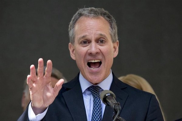 New York State attorney general Eric Schneiderman speaks at a rally to celebrate the passage of the minimum wage for fast-food workers by the New York State Fast Food Wage Board in New York