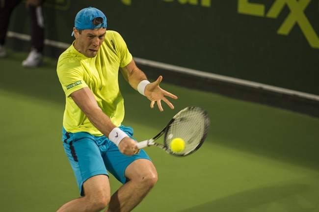 Ukraine's Illya Marchenko returns the ball against Teymuraz Gabashvili of Russia at the Qatar Open 2016 in Doha Qatar Wednesday Jan. 6 2016