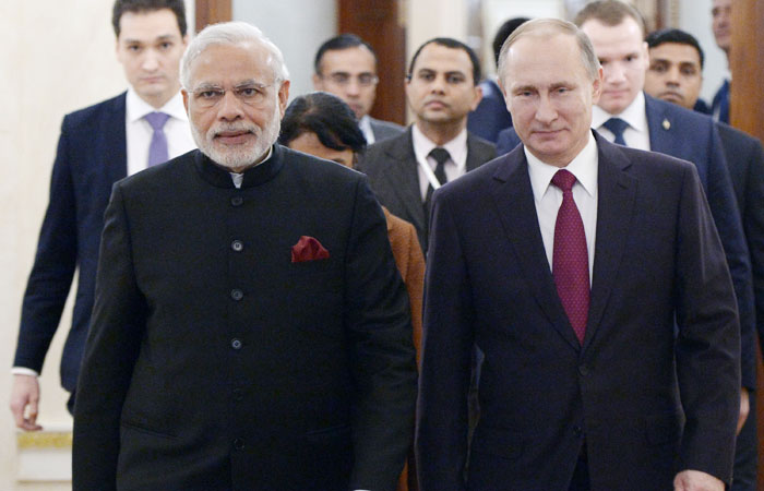 PM walks during national anthem, Russian official nudges him back