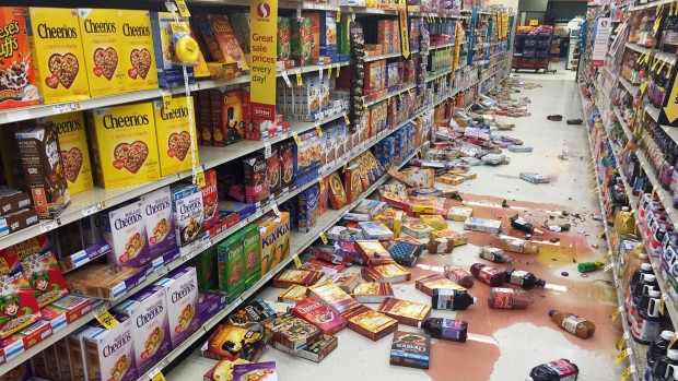 Boxes of cereal and bottles of juice lie on the floor of a Safeway grocery store following a magnitude 6.8 earthquake on the Kenai Peninsula in south-central Alaska on Sunday