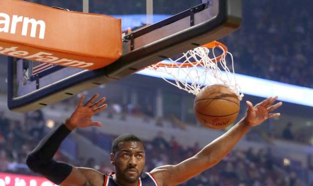 Washington Wizards guard John Wall dunks the ball during the first half of an NBA basketball game against the Chicago Bulls Monday Jan. 11 2016 in Chicago