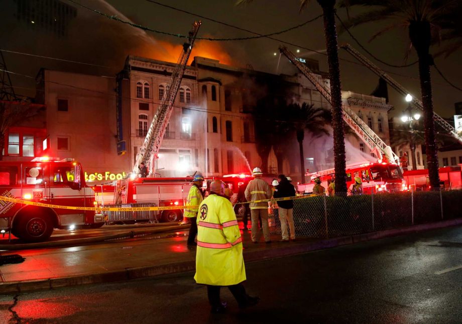 Firefighters battle a fire on Canal Street in downtown New Orleans Wednesday Jan. 27 2016