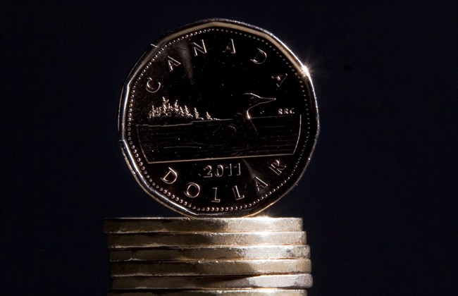 The loonie is will likely dip further below 70 cents U.S. experts say