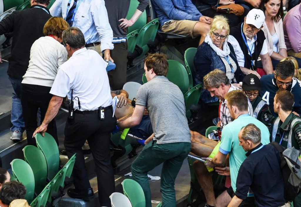 Nigel Sears is treated by medics after collapse EPA