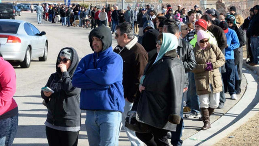 Hundreds of people wait in line to purchase tickets for the Powerball lottery at the CA lotto store in San Bernardino County California on the California Nevada state line