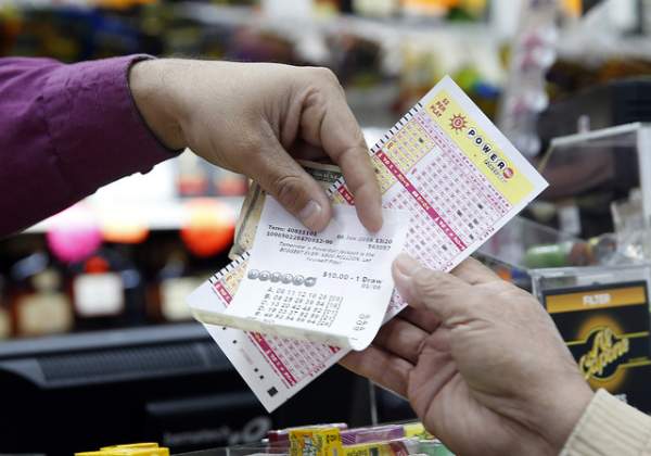 Powerball tickets are shown in San Lorenzo Calif. No ticket matched all six Powerball numbers following the drawing for a record jackpot of nearly $950 million lottery officials said early Sunday Jan. 10 boostin