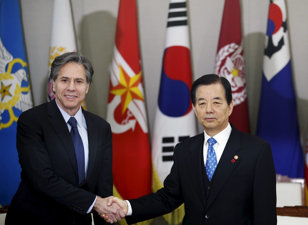 U.S. Deputy Secretary of State Antony Blinken shakes hands with South Korean Defense Minister Han Min Koo during their meeting at the Defense Ministry in Seoul South Korea