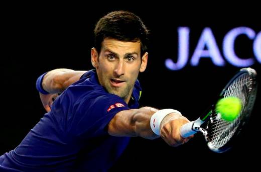 Novak Djokovic of Serbia stretches for a backhand in his second round match against Quentin Halys of France today