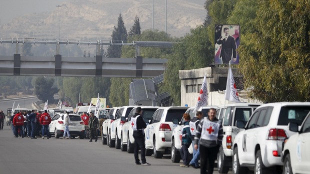 A convoy consisting of Red Cross Red Crescent and United Nations gather before heading towards Madaya in Syria to provide aid