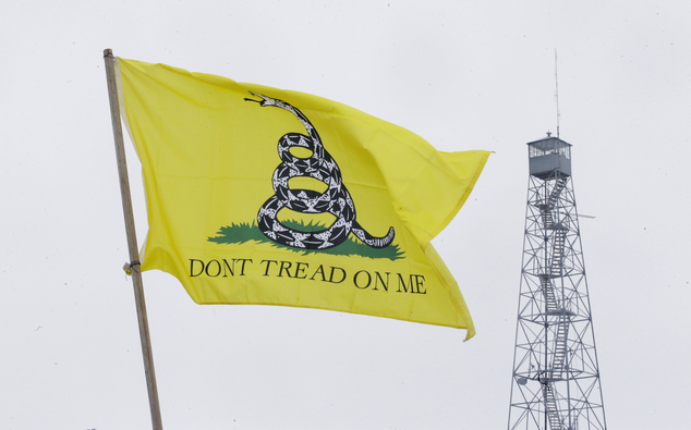 A Dont Tread On Me flag flies at the entrance of the Malheur National Wildlife Refuge Sunday Jan. 10 2016 near Burns Ore. A small armed group has been