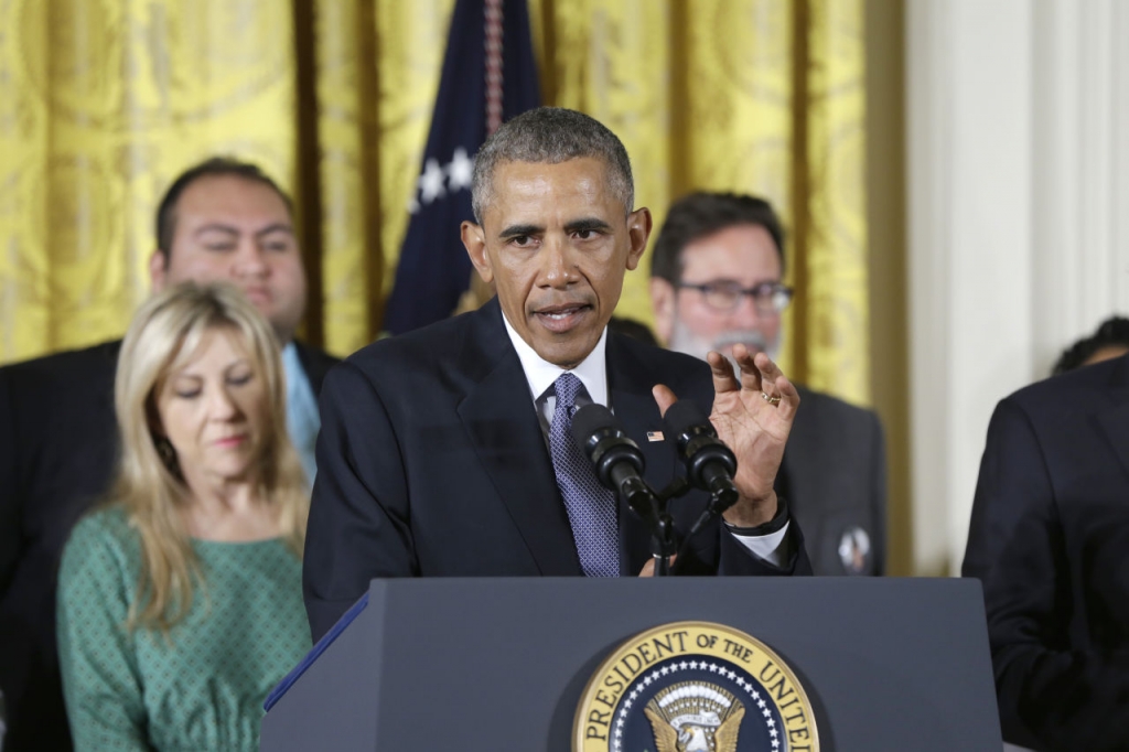 President Barack Obama joined by gun violence victims speaks in the East Room of the White House in Washington Tuesday Jan. 5 2016 about steps his administration is taking to reduce gun violence. Also on stage are stakeholders and individuals whose