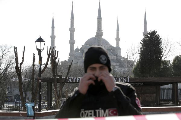 A policeman guards in front of the Blue Mosque at the historic Sultanahmet district after an explosion in Istanbul Tuesday Jan. 12 2016