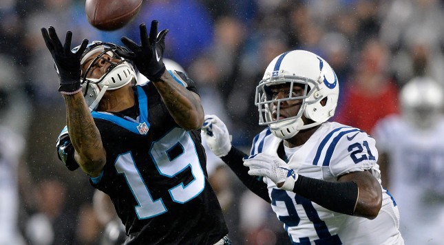 CHARLOTTE NC- NOVEMBER 02 Vontae Davis #21 of the Indianapolis Colts defends a pass to Ted Ginn #19 of the Carolina Panthers during their game at Bank of America Stadium