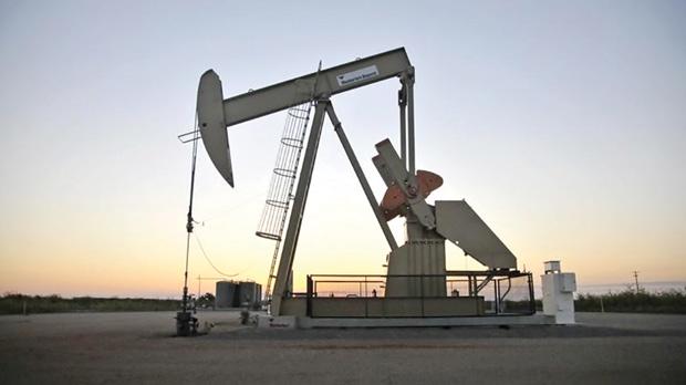 A pump jack operates at a well site leased by Devon Energy Production Company near Guthrie Oklahoma