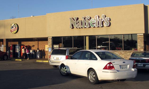 People stop at Naifeh's supermarket in Munford Tenn. Thursday Jan. 14 2016 where one of three winning tickets in the record Powerball jackpot was sold. The holder of the winning ticket will share the $1.6 billion jackpot with winners in Southern