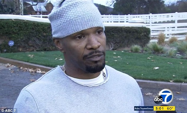 Real life action man Jamie Foxx met with local news reporters outside his luxury home on Tuesday and described how he rescued a man from a fiery wreck outside his front gates on Monday night