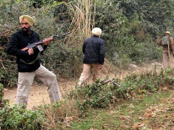 Security forces during their operation against the militants at the Indian Air Force base in Pathankot on Monday