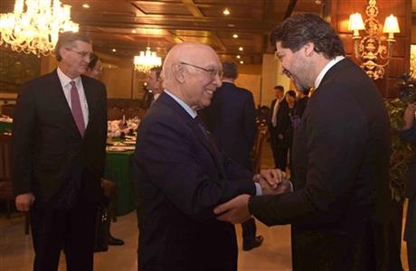 Press of Pakistan Afghanistan Deputy Foreign Minister Hekmat Khalil Karzai right shakes hands with Sartaj Aziz adviser to the Pakistani prime minister on foreign affairs prior to meeting of delegates from Pakista