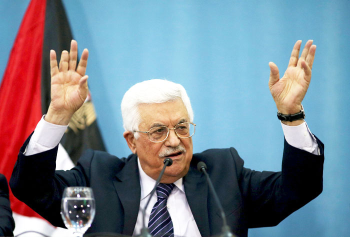 Palestinian President Mahmoud Abbas gestures as he speaks to the media in the West Bank city of Ramallah