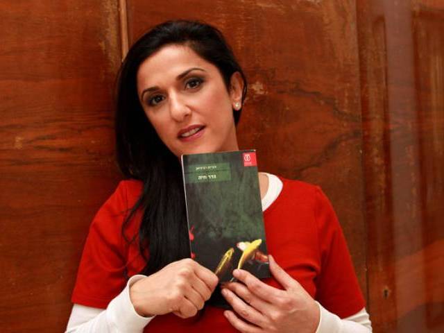 31 2015 shows Israeli author Dorit Rabinyan posing with her Hebrew-language novel titled'Gader Haya at her house in the coastal city of Tel Aviv