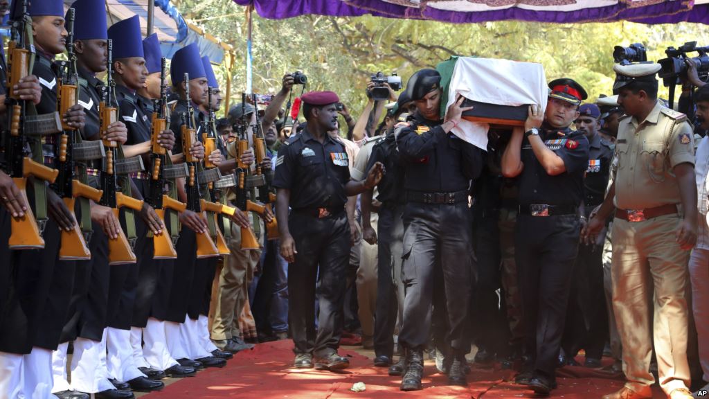 The body of India's National Security Guard commando Niranjan Kumar is carried by Indian soldiers as they pay their last respects in Bangalore India Jan. 4 2016