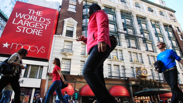 Pedestrians pass Macy's department store