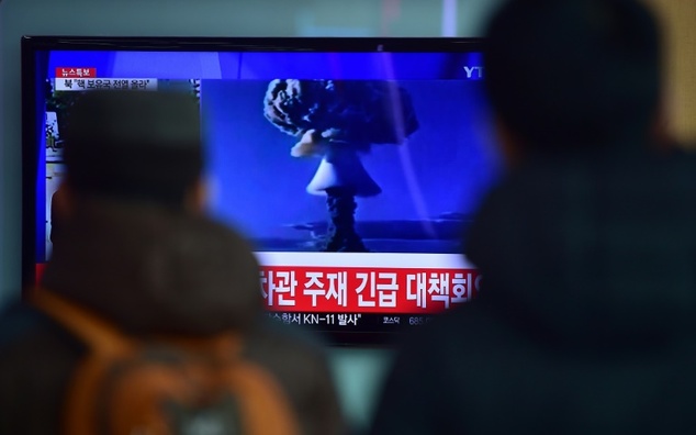 People watch a news report on North Korea's latest nuclear test at a railway station in Seoul